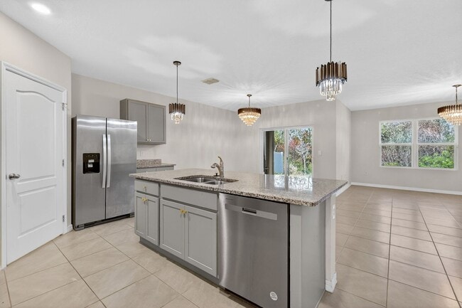 Building Photo - Available Now in Tavares | 2023 Built 4BR/2BA Home with 2-Car Garage