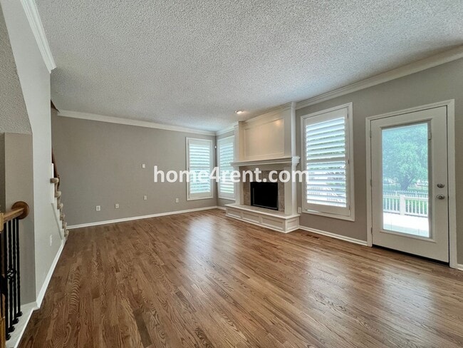 Building Photo - Updated Kitchen, Large Two Tiered Deck, Finished Basement in Blue Valley Schools!
