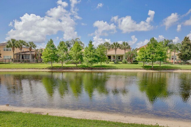 Building Photo - Gorgeous 2/2 + Den Mediterranean Villa with Waterfront Screened Patio and 2-Car Garage in the Pre...