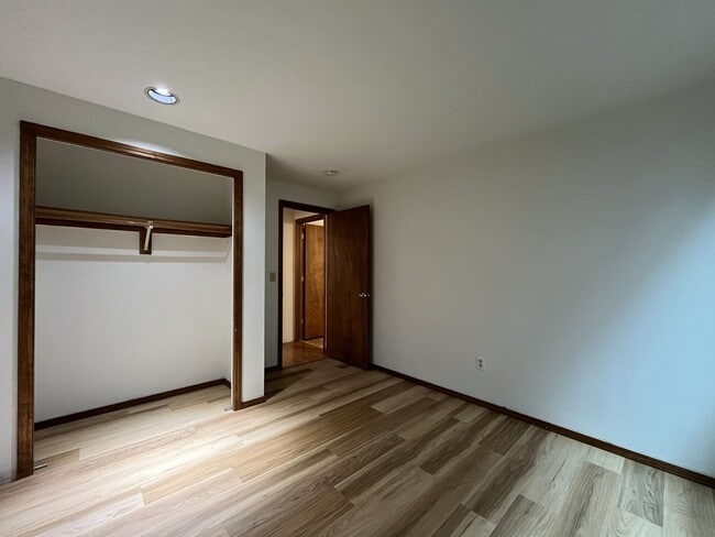 Building Photo - Spacious 3-Bedroom Home with Custom Stone Fireplace, Attached 2-Car Garage & Expansive Backyard i...