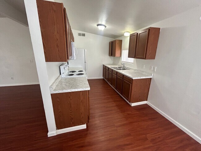Building Photo - Single story home with large backyard and huge carport with plenty of storage.