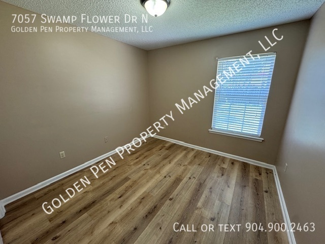 Building Photo - 7057 Swamp Flower Dr N