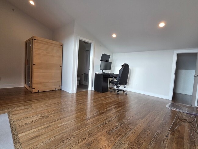 Building Photo - STUNNING 4-LEVEL TOWNHOME IN HIGHLANDS WITH SAUNA, 2-CAR GARAGE + AMAZING ROOFTOP DECK!