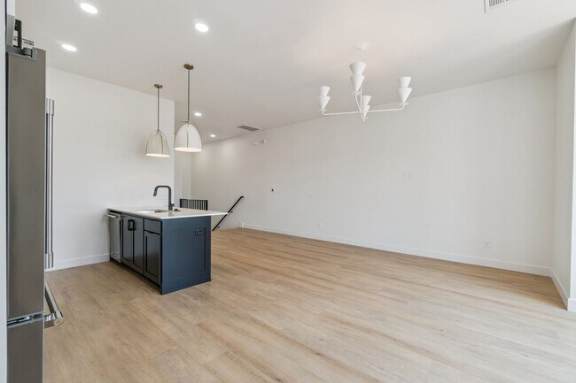 Building Photo - Bright. Clean. Calm. Your Elevated One-Bed...