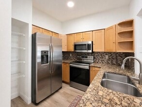 Building Photo - 3-bedroom + den, 2-bath condo at The Tides at Pelican Landing