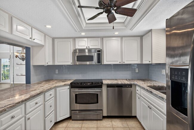 Building Photo - Gulf Access 2 bedroom 2 Bath Fully updated Condo with Water View