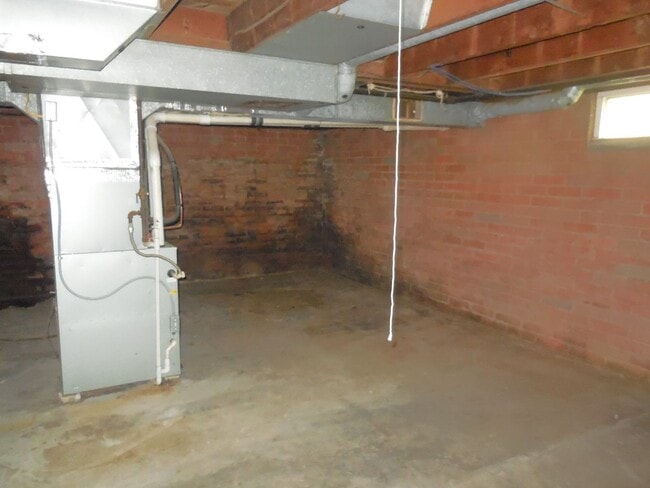 Building Photo - Two Bedroom House with Drive Under Garage!