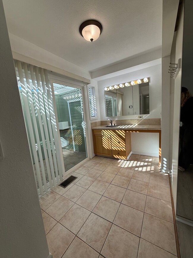 Building Photo - Hard floors, extra closets, patios & fence...