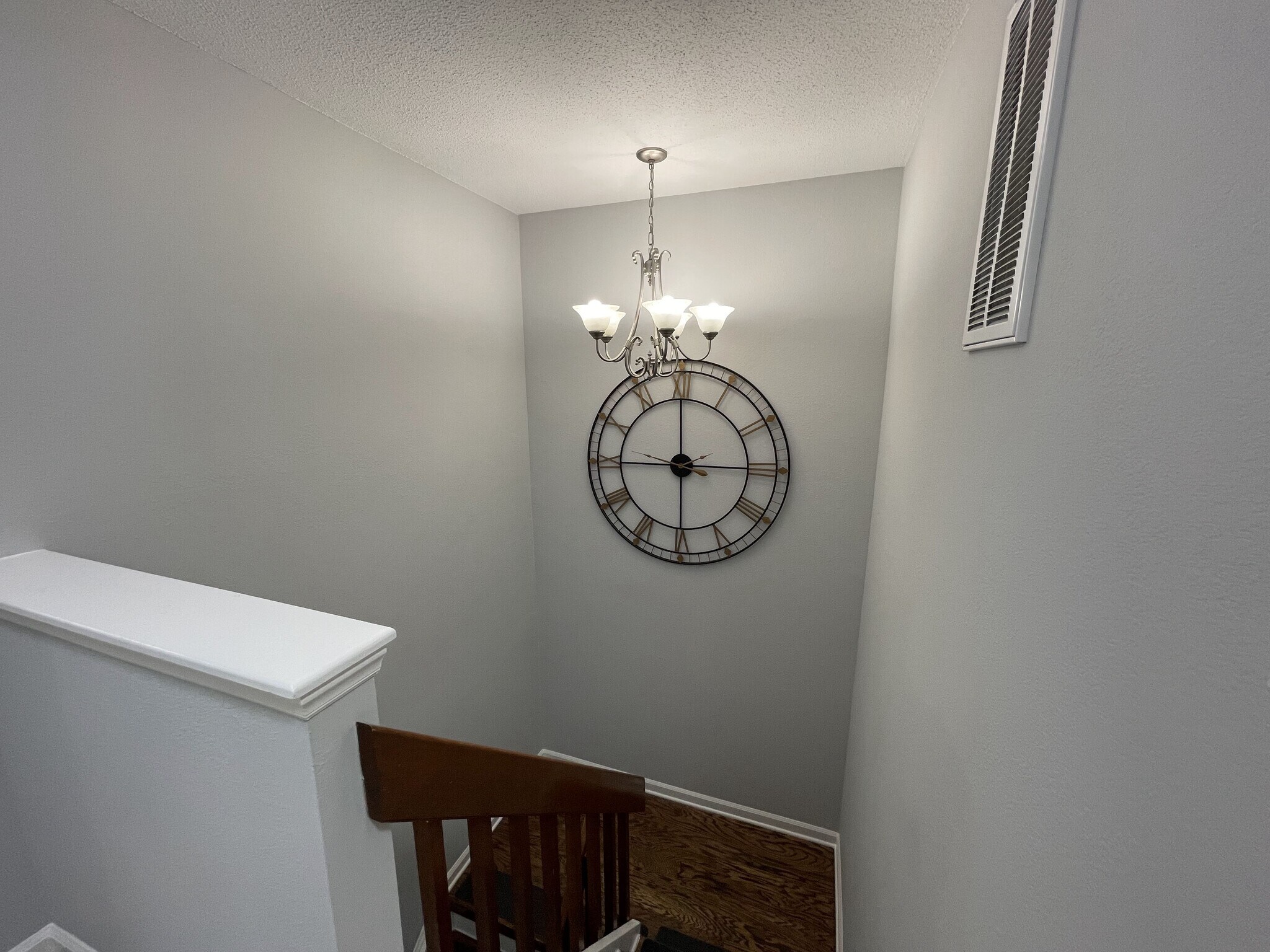 Stairway with chandelier and landing (looking down) - 4204 Whistler Ct