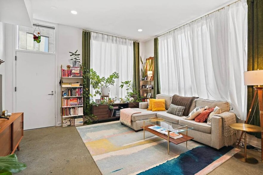 Ceiling-high windows allow for streaming sunlight. - 1414 Belmont St NW