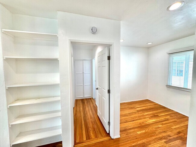 Building Photo - An apartment with character! Hardwood floo...