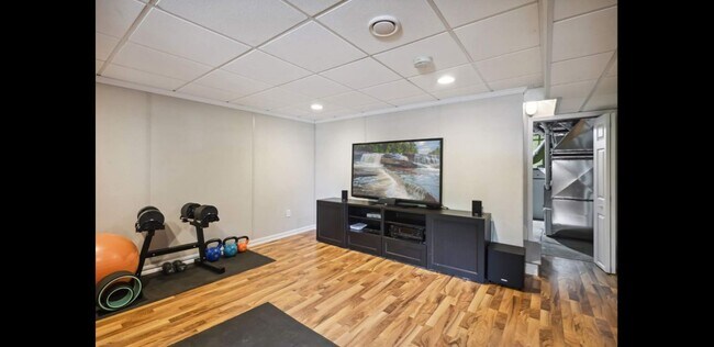 Lower level rec room with exterior door access - 2740 Alabama Ave S