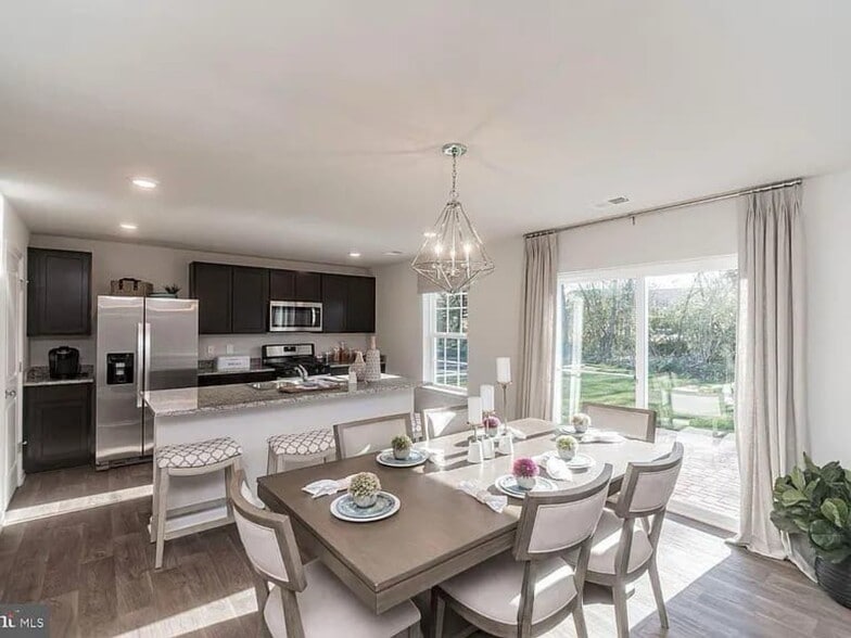 Dining area overlooking the beautiful backyard - 377 Aylesbury Ln