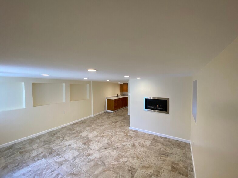 downstairs bonus room with sink on left - 567 59th St
