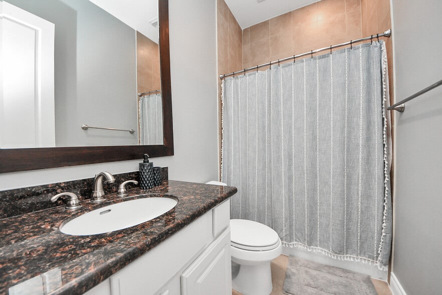Spacious layout complemented by clean, calming tones. - 620 Rutland St