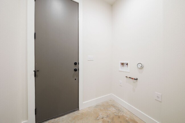 Building Photo - Luxury Redefined: Experience Vibrant Living in this 3-Bedroom Haven in East Austin