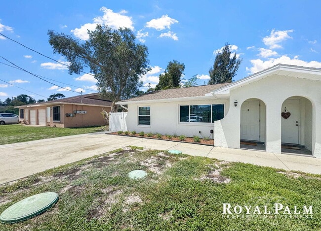Building Photo - Tree-Lined 2BR/1BA Fort Myers Duplex with Fenced Yard, Storage Shed & In-Unit Laundry!