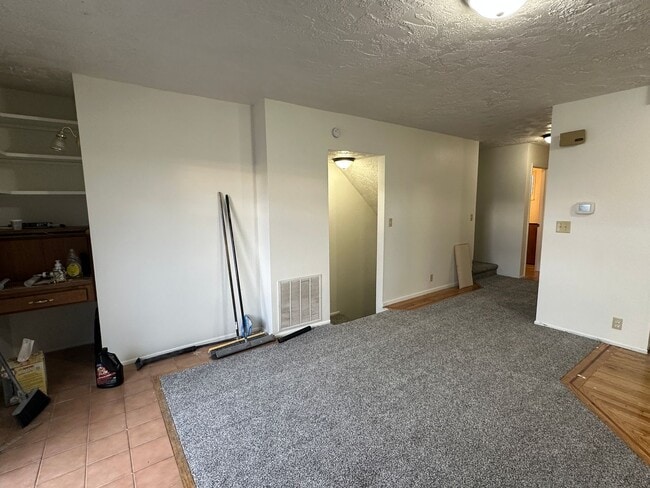 Building Photo - Spacious, three level, 4 Bed 2.5 bath Townhome in Ammon right behind the Walmart on Hitt.