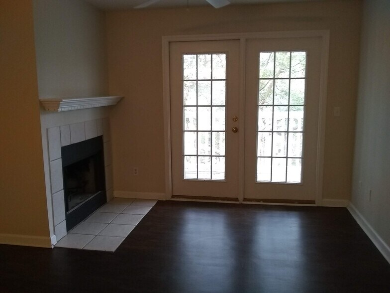Great room with fireplace, french doors - 100 Kensington Blvd