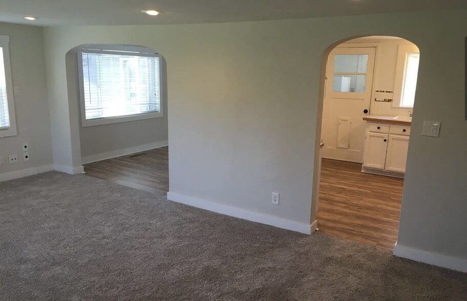 Living room, has LVP flooring now - 919 E McLeod Rd