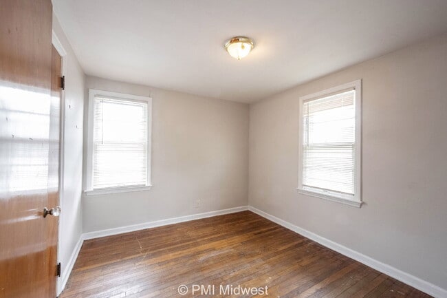 Building Photo - "Charming 2-Bedroom Duplex with Gleaming Hardwood Floors in Indy!"