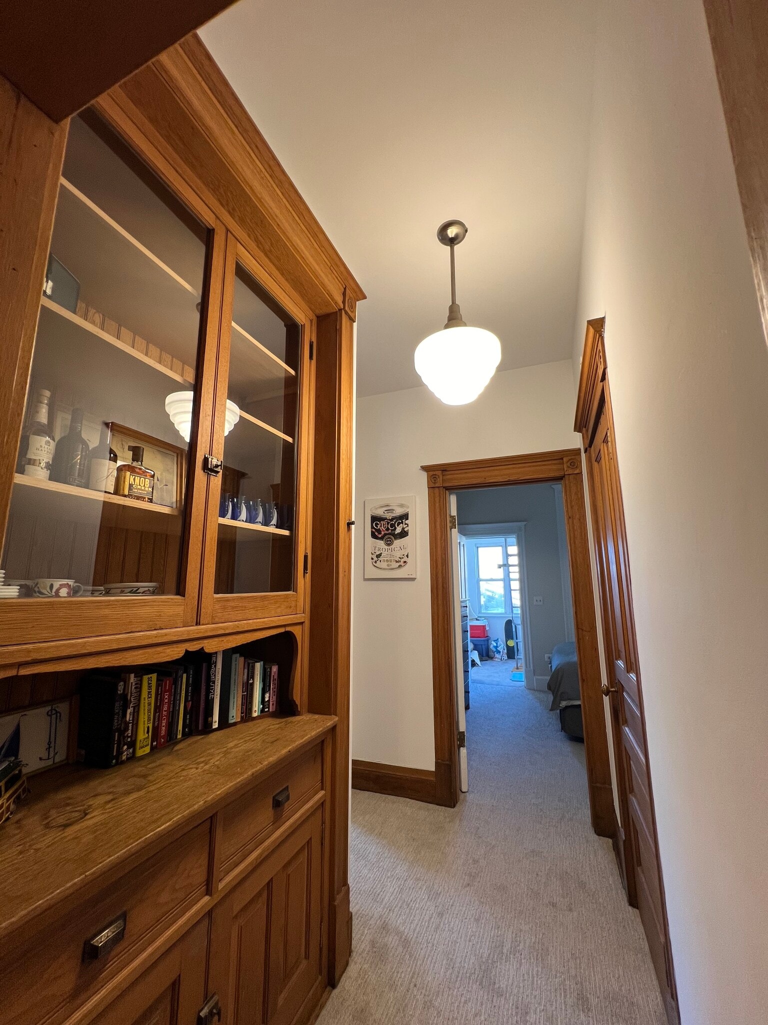 Beautiful hallway with tall ceilings and built-in bookcase and storage - 938 W Newport Ave
