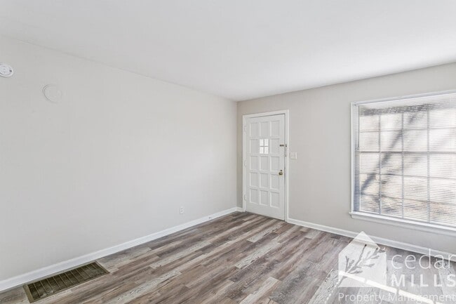 Building Photo - Updated, clean unit, with LARGE basement for storage!