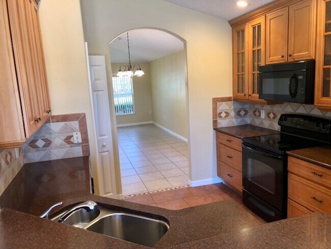 Building Photo - EAGLE CREEK LAKE NONA! WELCOME HOME! Beautiful water views! Spacious 2 story-3 bedroom 2.5 bath h...