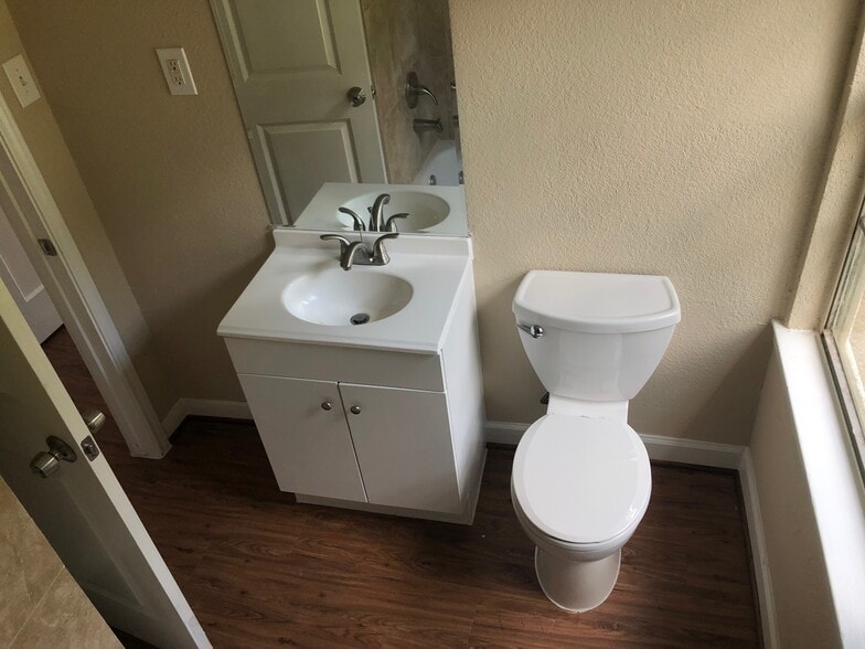 Second bathroom. New floors, toilet, lavatory, shower. - 5235 Kingsbury St
