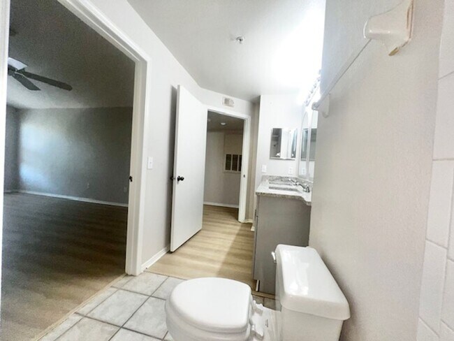 Building Photo - NEW-Remodeled bathroom & kitchen! NEW VINYL PLANK flooring & fresh paint! 2 bedroom 1 bath condo ...