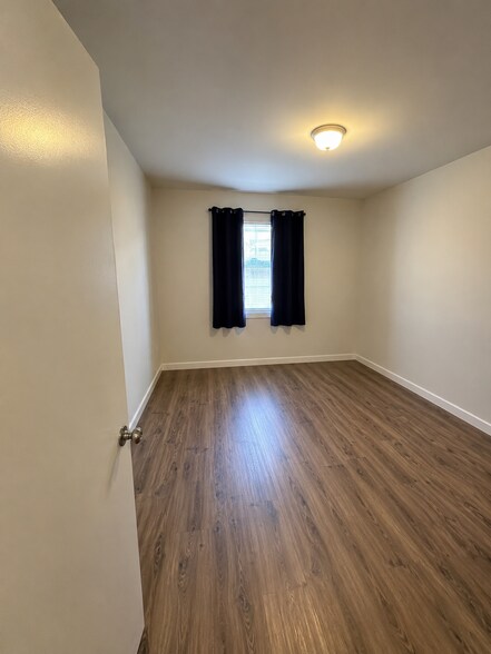 bedroom with new double pane windows - 4091 Rosecrans Ave