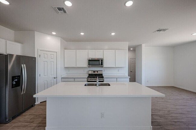 Building Photo - HOME IN LAVEEN! 4 BED 3.5 BA 3 CAR GARAGE!...