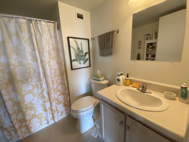 bathroom with shower and tub - 901 Jefferson St