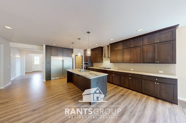 Building Photo - Luxury 4-Bedroom Home with 5-Car Garage & ...