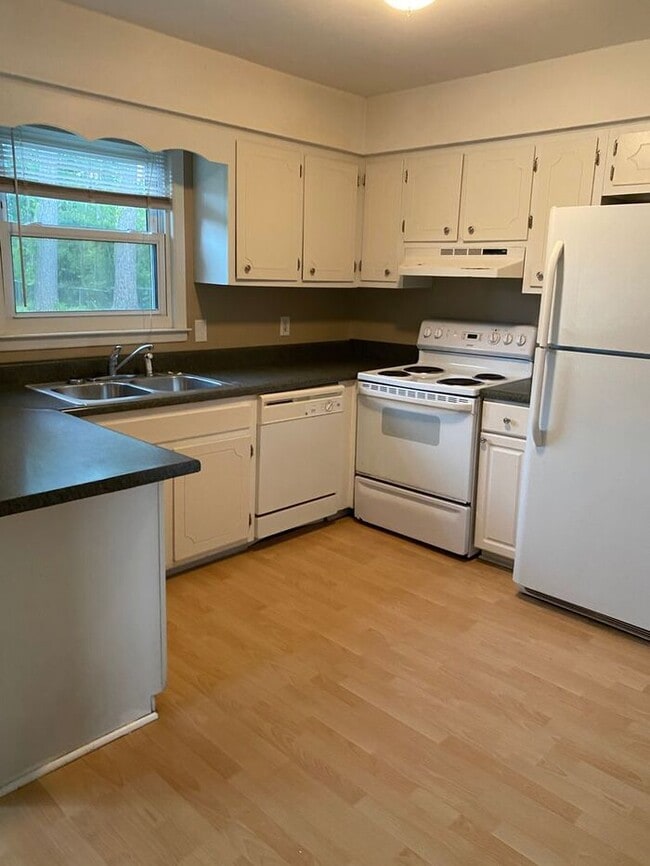 Building Photo - COMING SOON! 4Br, 2.5 baths, large kitchen, large bedrooms, fence, storage and more! N. College R...