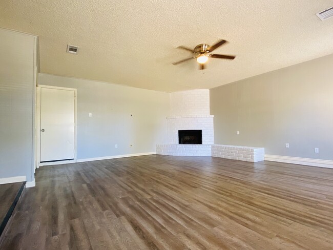 Spacious living room with cozy fireplace - 2817 12th Ave N