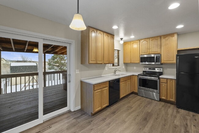 Building Photo - Spacious Split-Level Home with Finished Basement, Deck, Fenced Yard & 2-Car Garage