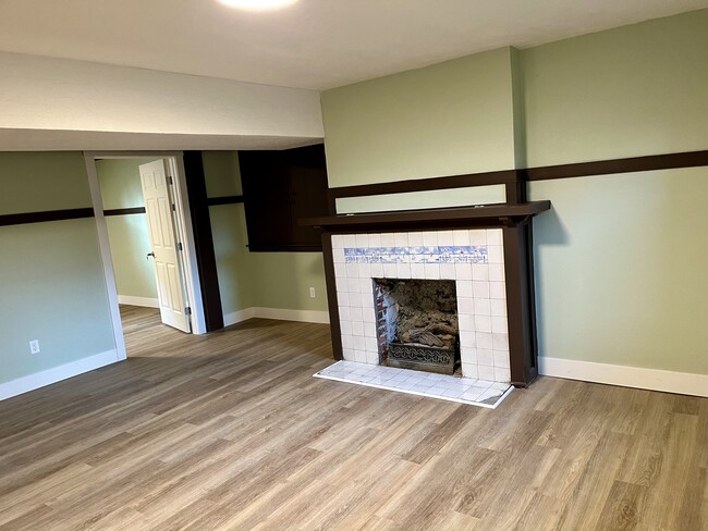 Living area and large built-in storage, to left. Trim rail. - 1401 W 13th Ave