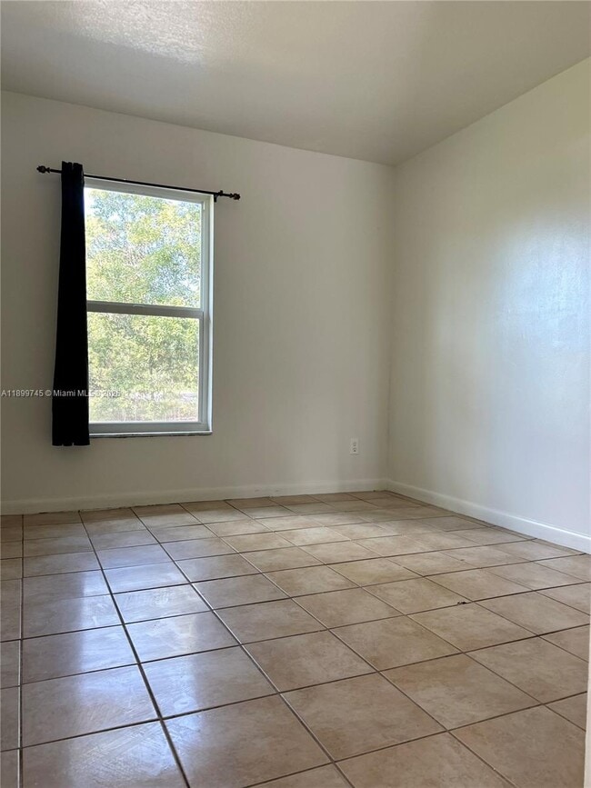 Building Photo - 6452 Royal Palm Beach Blvd