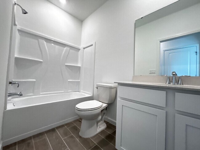 Building Photo - Brand New Pristine 4/3 minutes from River ...