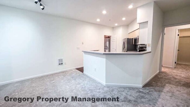 Building Photo - Sunlit & Spacious Ground-Level Condo | 12-Foot Ceilings, Luxury Amenities & Ideal Locale