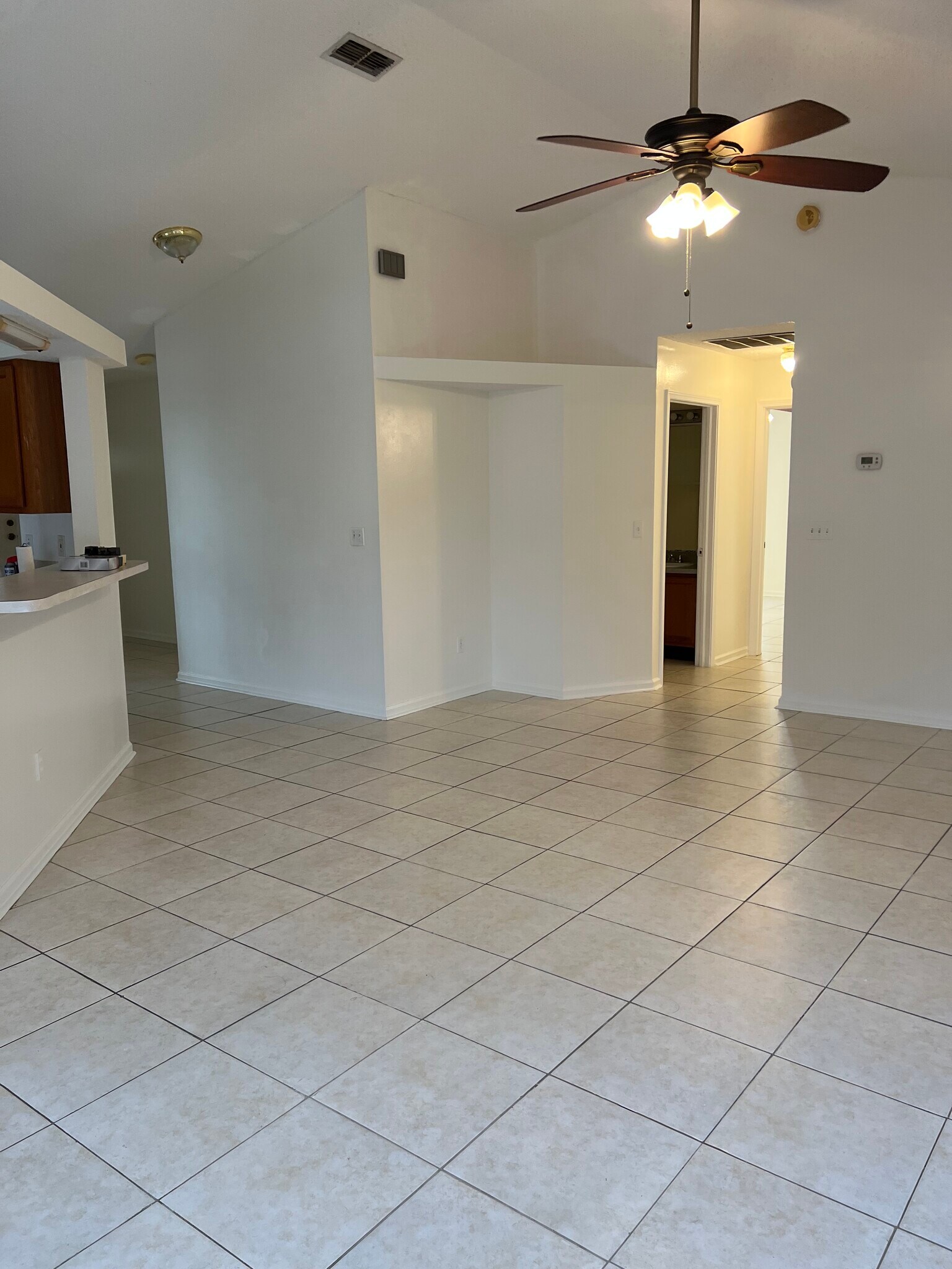 Enjoy a bright and spacious living room with an open layout and a convenient counter pass-through to - 5374 Lacy Jane Way