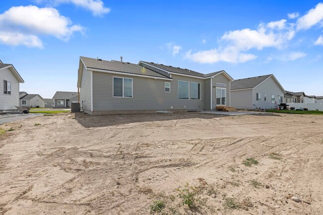 Building Photo - NEW HOME with large garage stalls and unfinished basement for additional storage