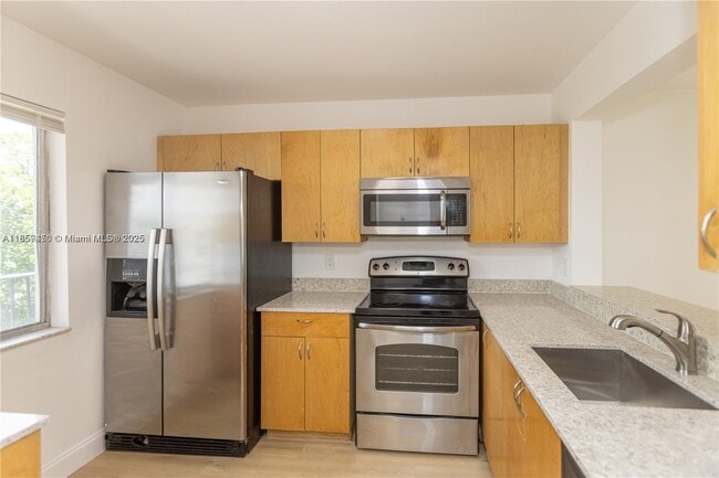 Building Photo - $2,100MONTHLY;8740 N SHERMAN CIR. #408 MIR...