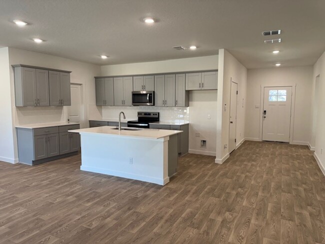 Building Photo - BRAND NEW 4 BR / 2 BA with THREE-CAR GARAG...