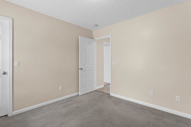 Building Photo - House with Fenced Back Yard Available!