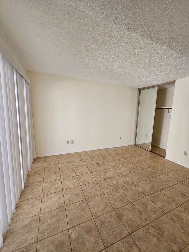 Building Photo - Beautifully Updated 2BR/2BA with Loft Oasis – Safe & Gated Community