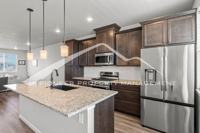 Building Photo - Contemporary Townhome in the Vibrant Interquest Low Maintenance Community with 2 car garage, Wash...
