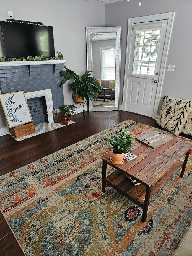 living room with fire place - 127 E Park Ave