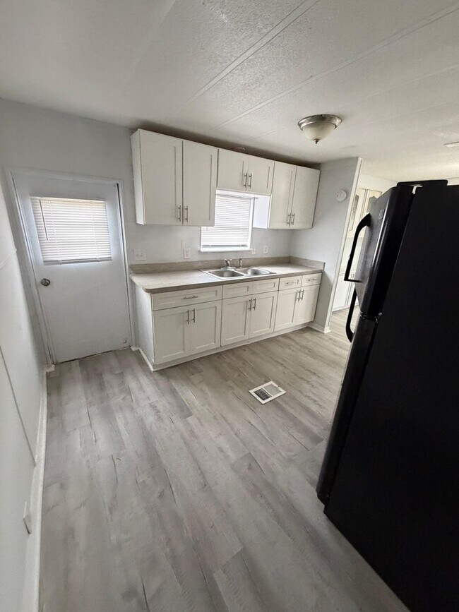 Building Photo - Woodland Estates MHP